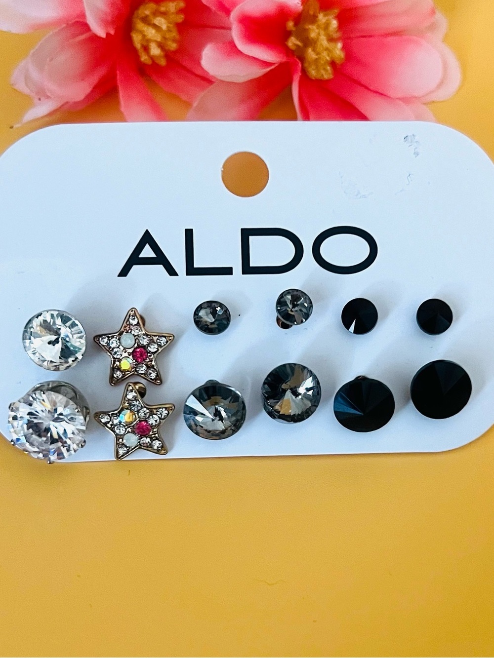 Six pairs of earrings by Aldo, NWT